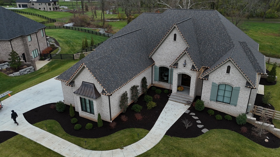 The same white-brick estate with the C9 roofline installed